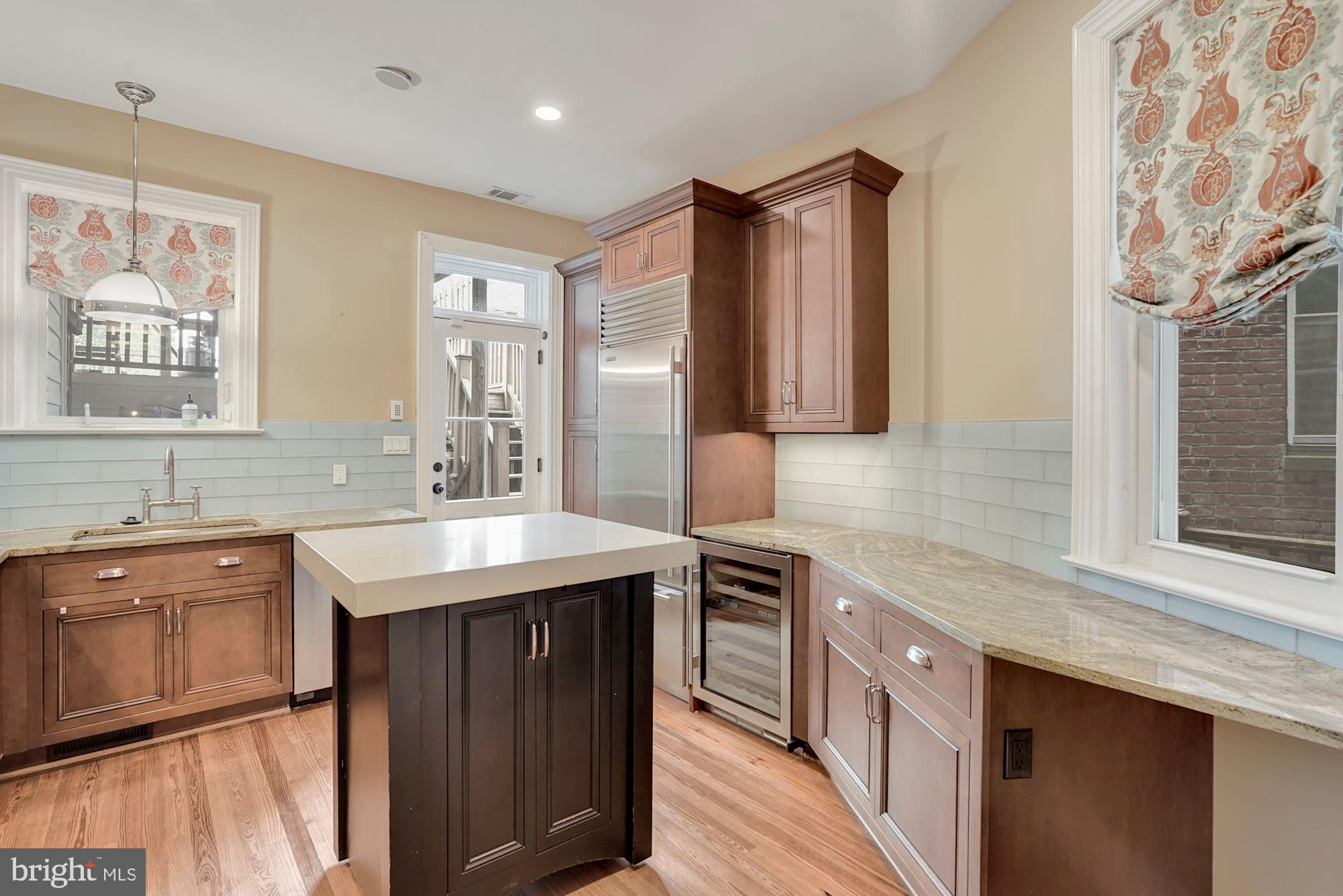 2721 2721-upper Ontario Road Northwest Washington, DC 20009 - Photo 10 of 31 a kitchen with a sink stove and cabinets