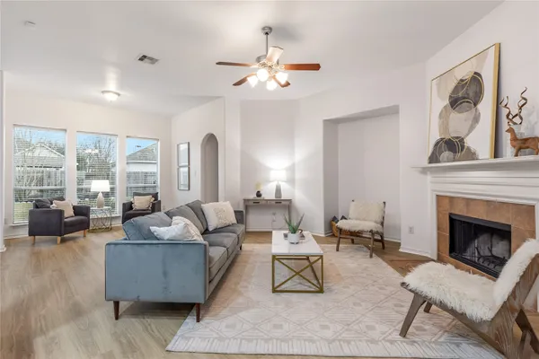 a living room with furniture and a fireplace