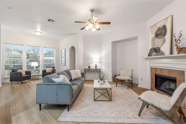 a living room with furniture and a fireplace