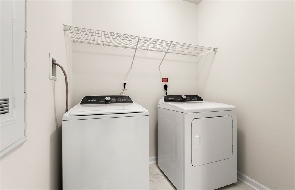 6 Stratton Drive, Unit 303 Woburn, MA 01801 - Photo 26 of 29 a utility room with dryer and washer