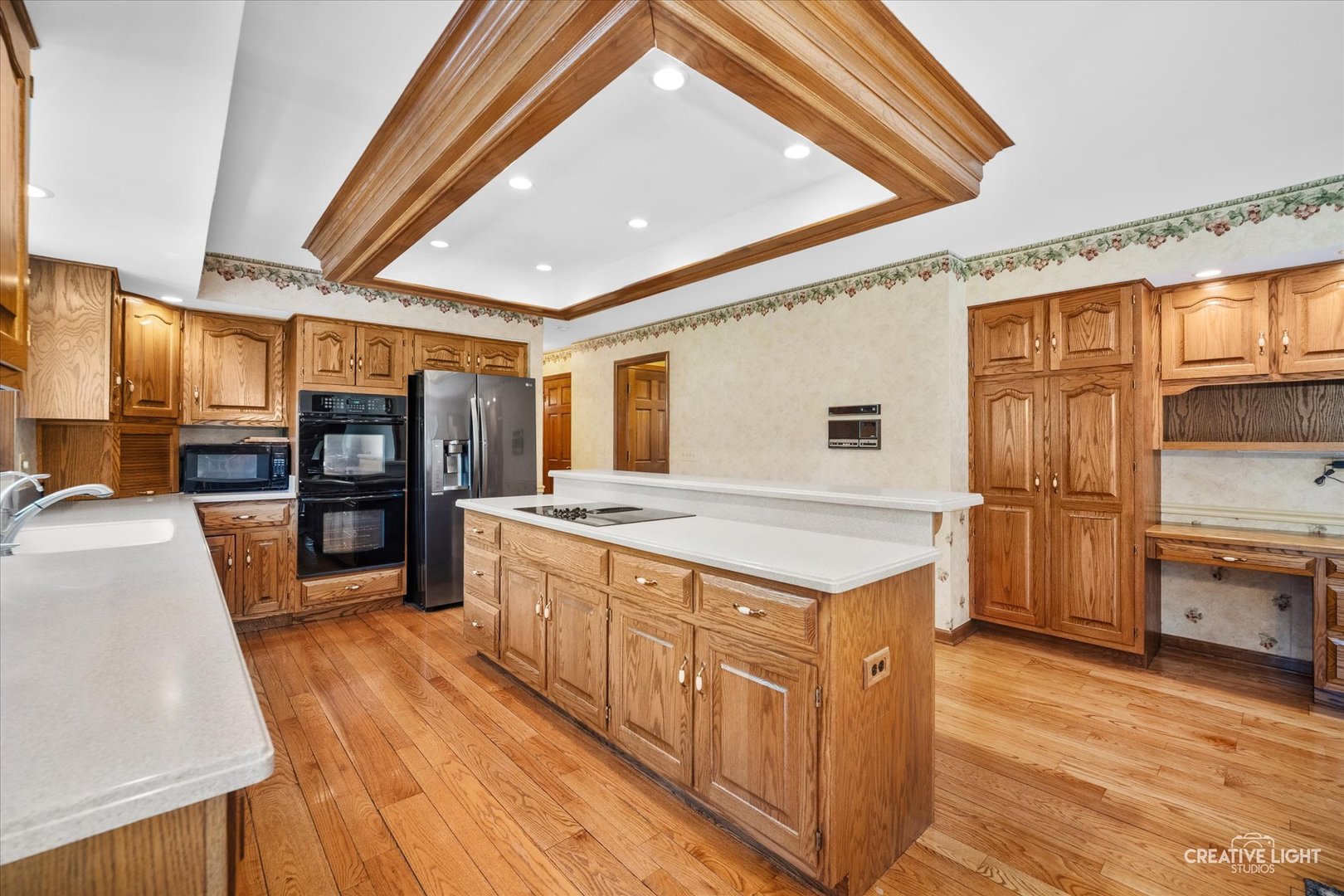 3112 Turnberry Road St. Charles, IL 60174 - Photo 11 of 43 a large kitchen with stainless steel appliances granite countertop a large stove a sink dishwasher and cabinets with wooden floor