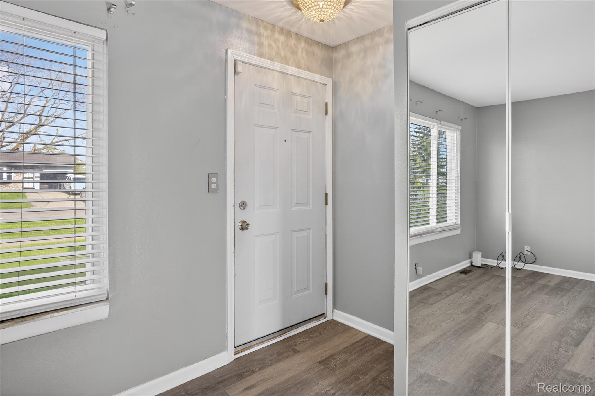 6169 Neff Road Mount Morris, MI 48458 - Photo 12 of 49 Foyer with dark wood finished floors and baseboards