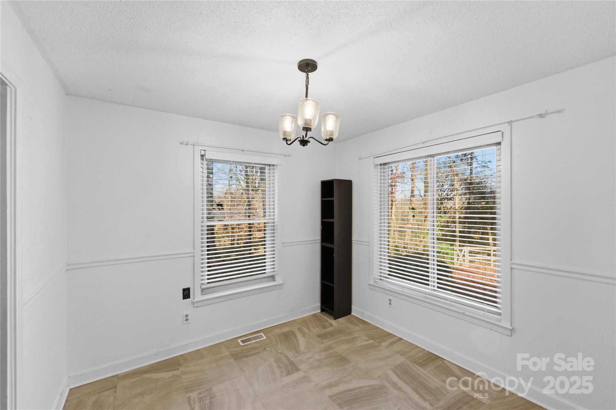 1051 Cox Mill Road Concord, NC 28027 - Photo 19 of 48 a view of a livingroom with a chandelier