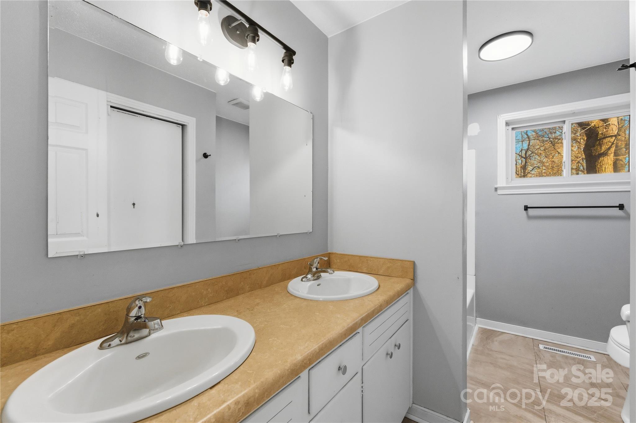 1051 Cox Mill Road Concord, NC 28027 - Photo 22 of 48 a bathroom with a sink and a mirror