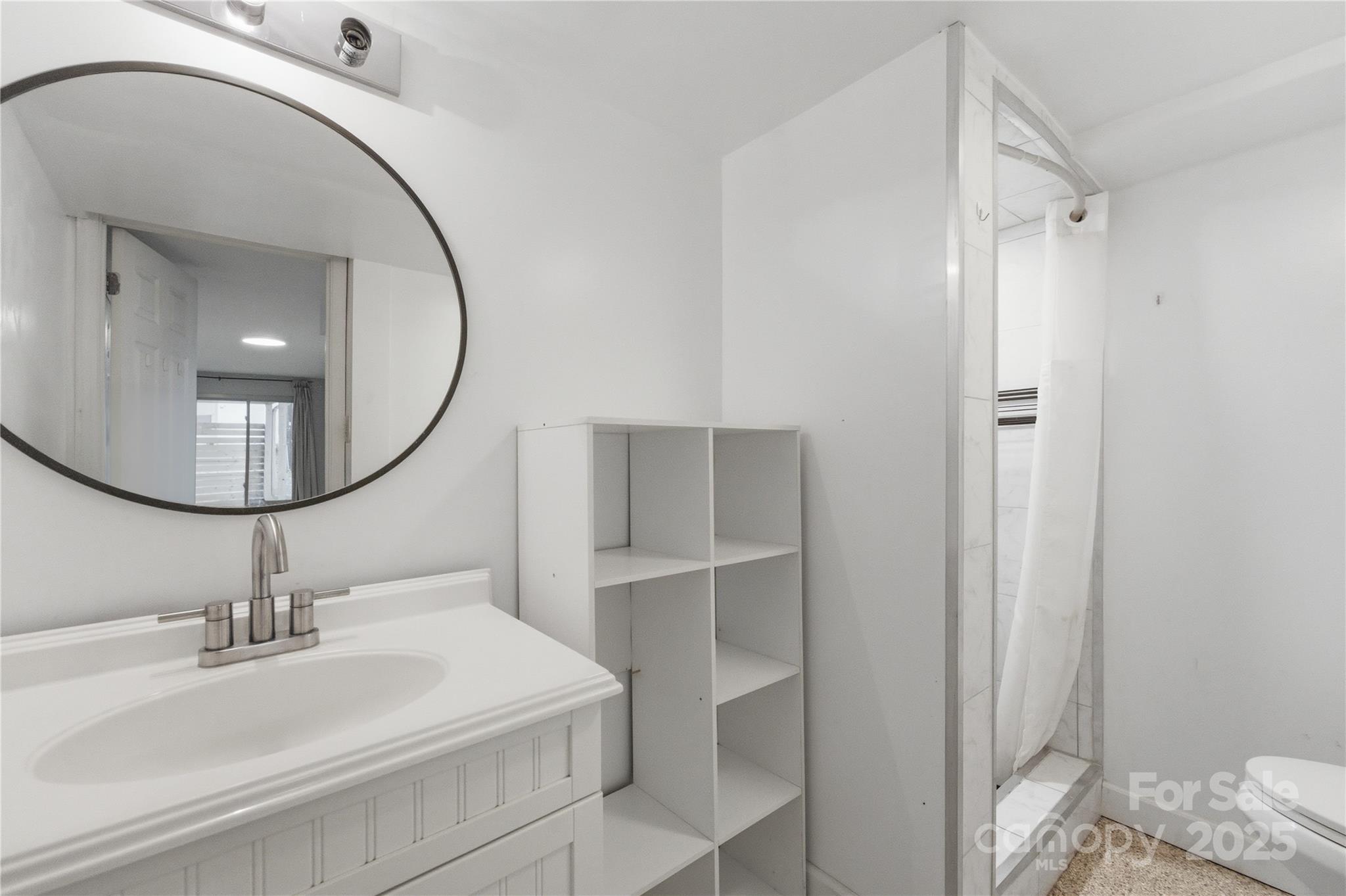 1051 Cox Mill Road Concord, NC 28027 - Photo 34 of 48 a bathroom with a sink and a mirror