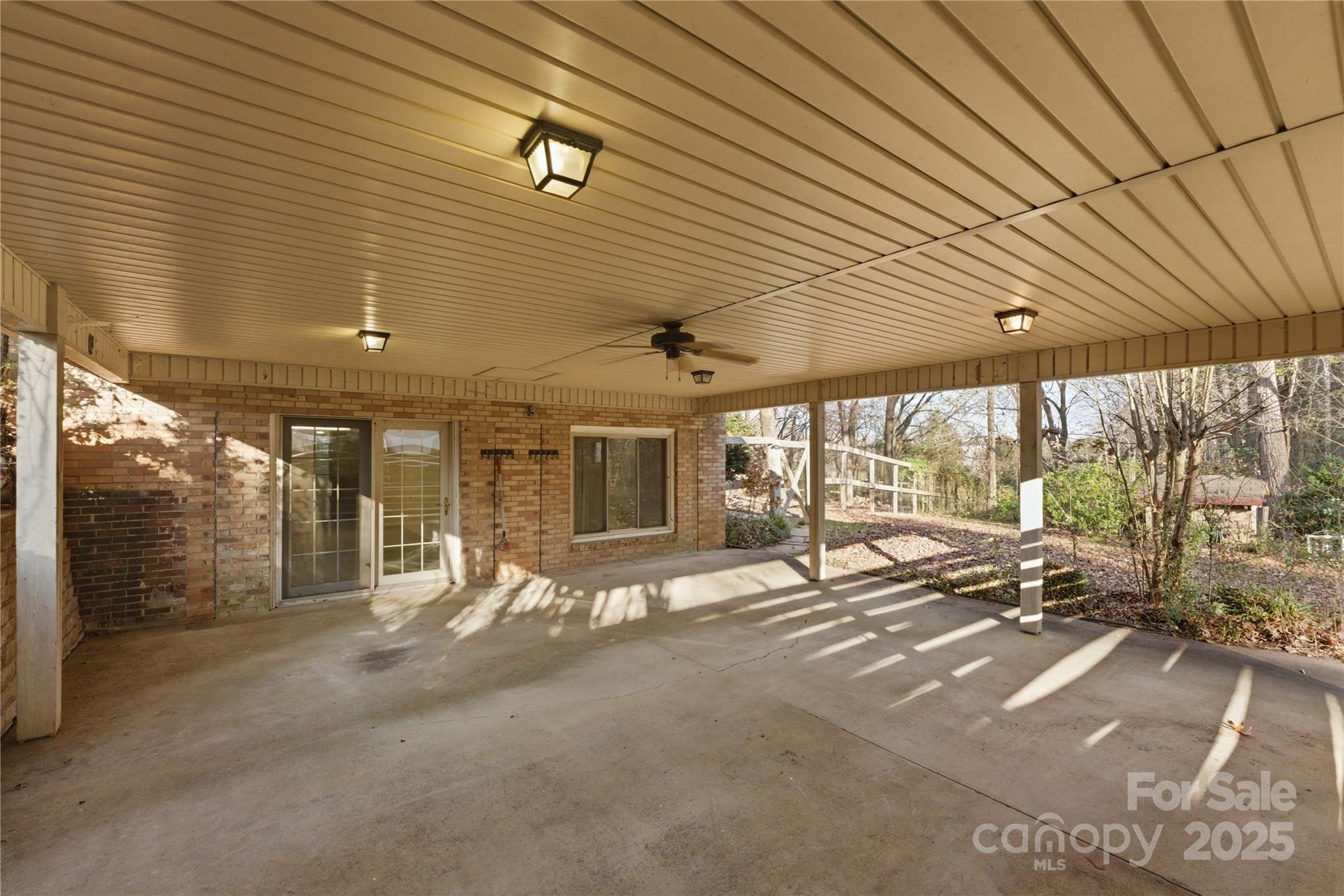 1051 Cox Mill Road Concord, NC 28027 - Photo 37 of 48 a view of a patio with table and chairs under an umbrella