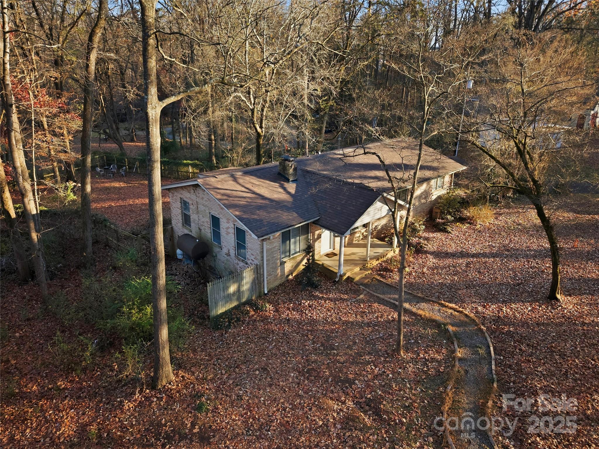 1051 Cox Mill Road Concord, NC 28027 - Photo 45 of 48 a view of a patio with table and chairs and wooden floor