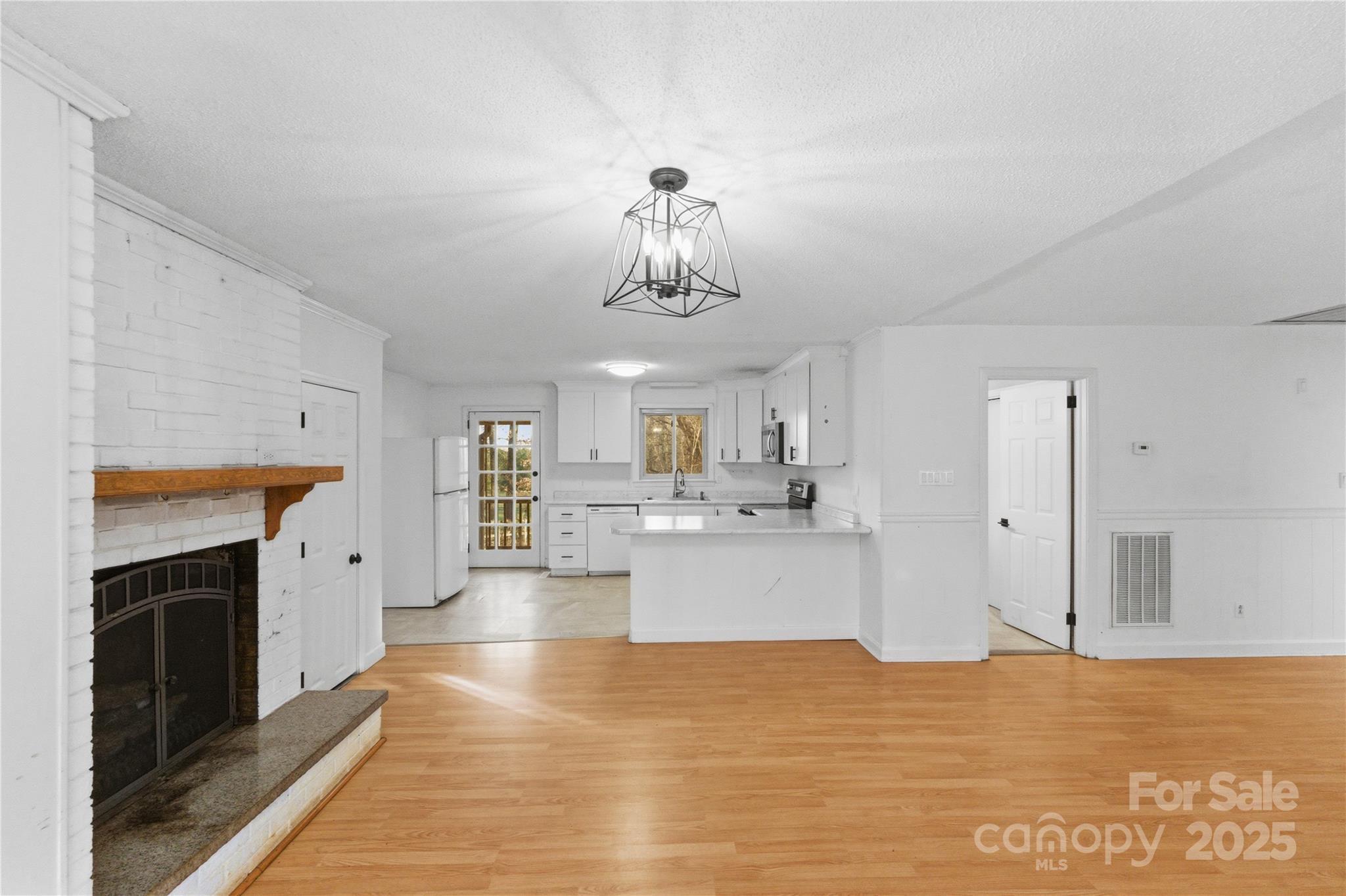 1051 Cox Mill Road Concord, NC 28027 - Photo 6 of 48 a kitchen with a refrigerator and a stove top oven