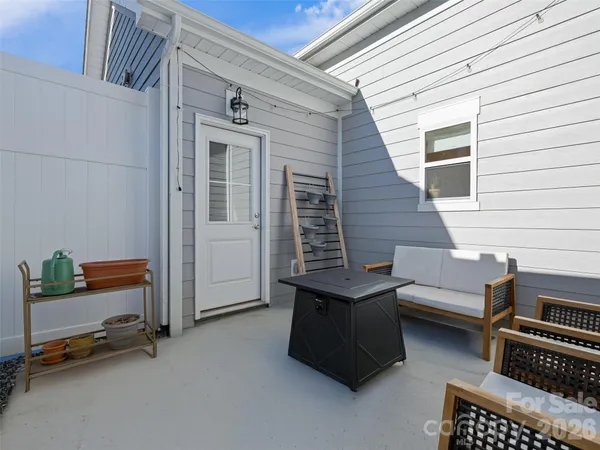 a view of a patio with a table and chairs
