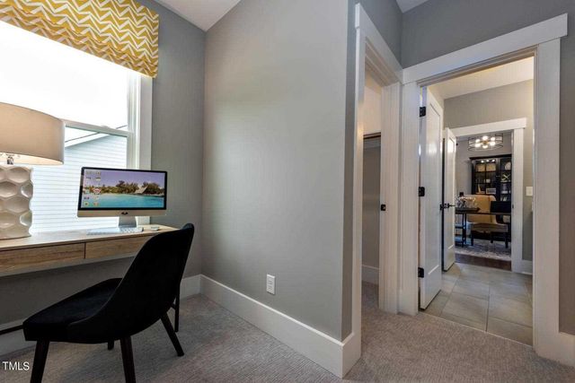 a spacious bedroom with a bed and a window