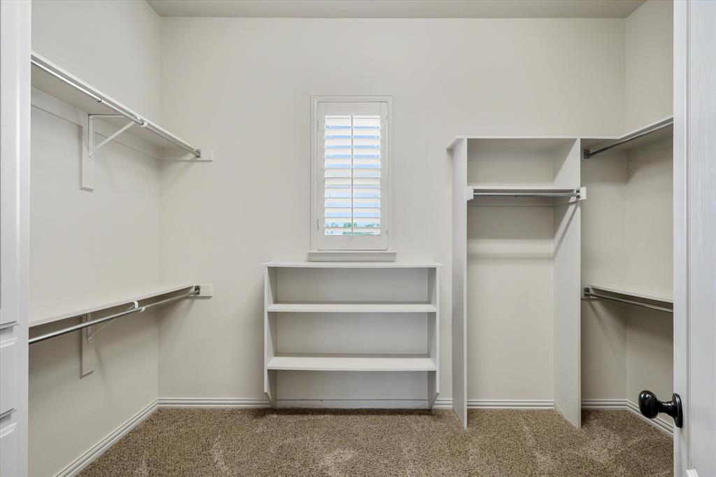 1852 Meadowview Canton, TX 75103 - Photo 18 of 28 a view of walk in closet with empty racks