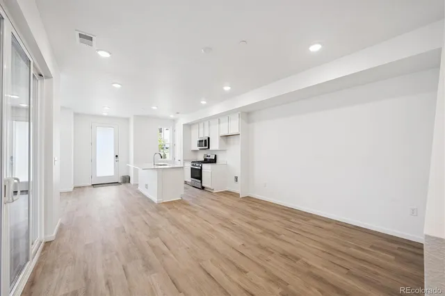 a view of kitchen with wooden floor