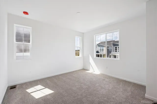 an empty room with windows