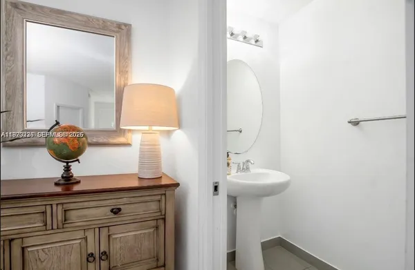 a bedroom with a bed and a chair