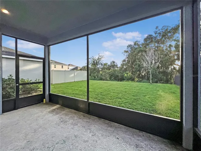 a view of a yard from a balcony