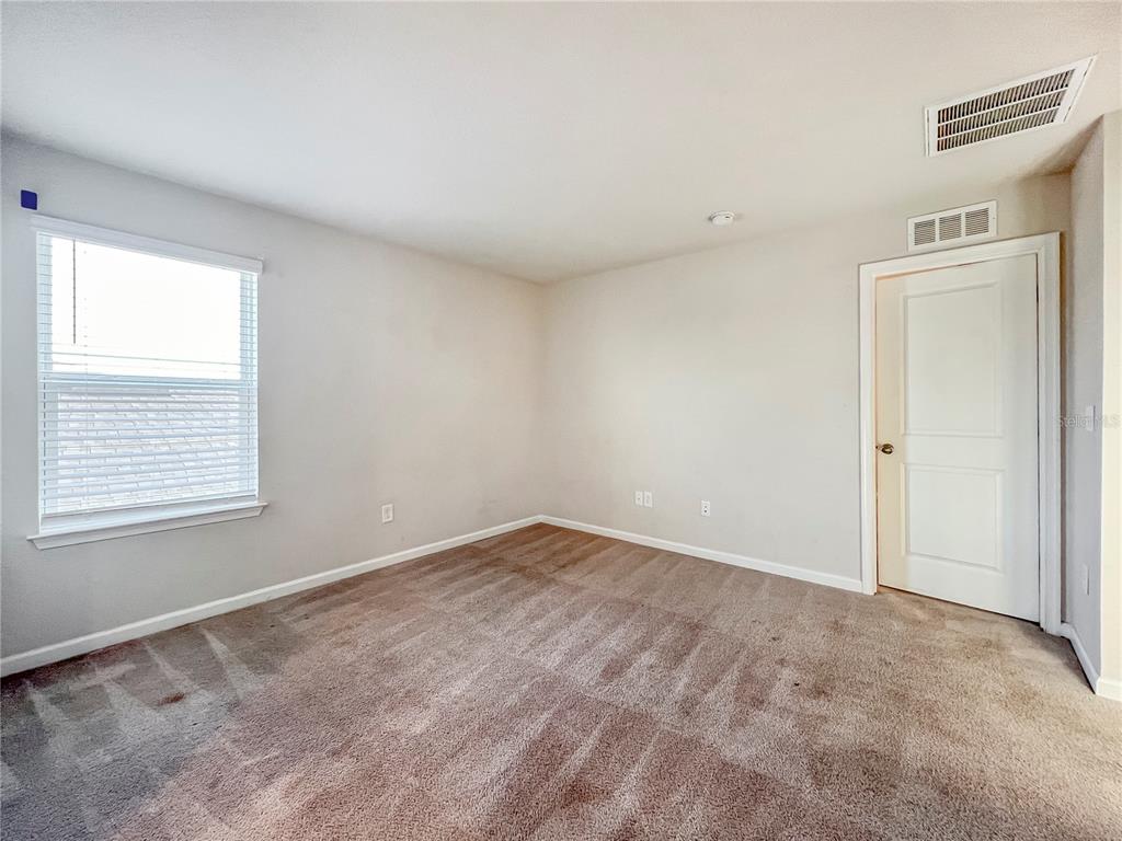 8511 Rain Lily Crossing Parrish, FL 34219 - Photo 25 of 34 an empty room with a window