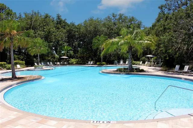 a view of a swimming pool with a sitting space