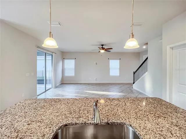 a view of an empty room and wooden floor