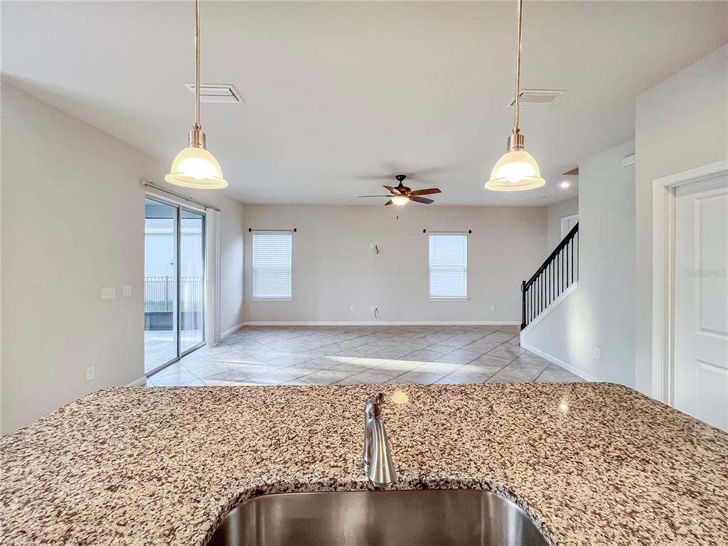 8511 Rain Lily Crossing Parrish, FL 34219 - Photo 10 of 34 a view of an empty room and wooden floor