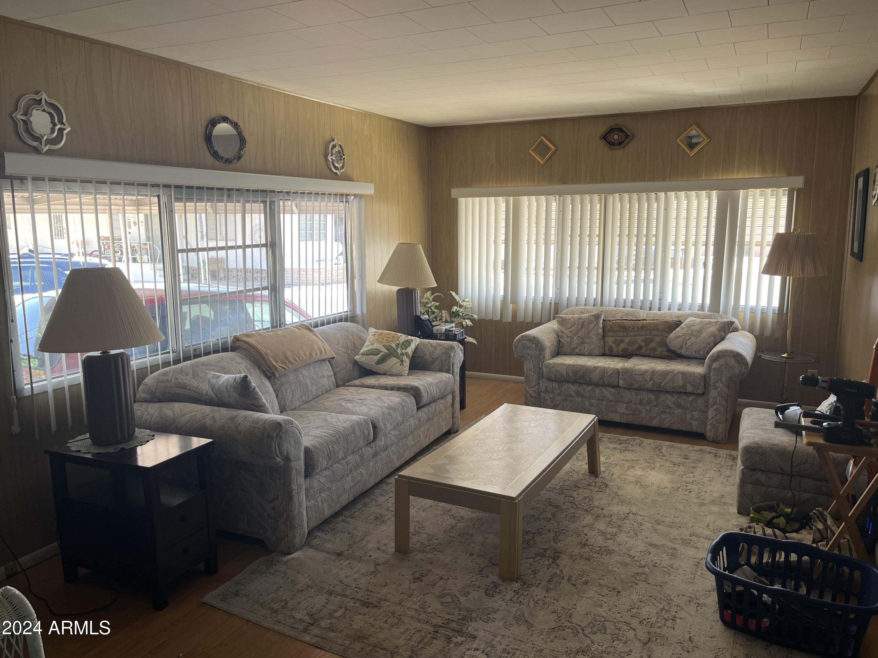2460 East Main Street, Unit F2 Mesa, AZ 85213 - Photo 4 of 17 a living room with furniture and a window