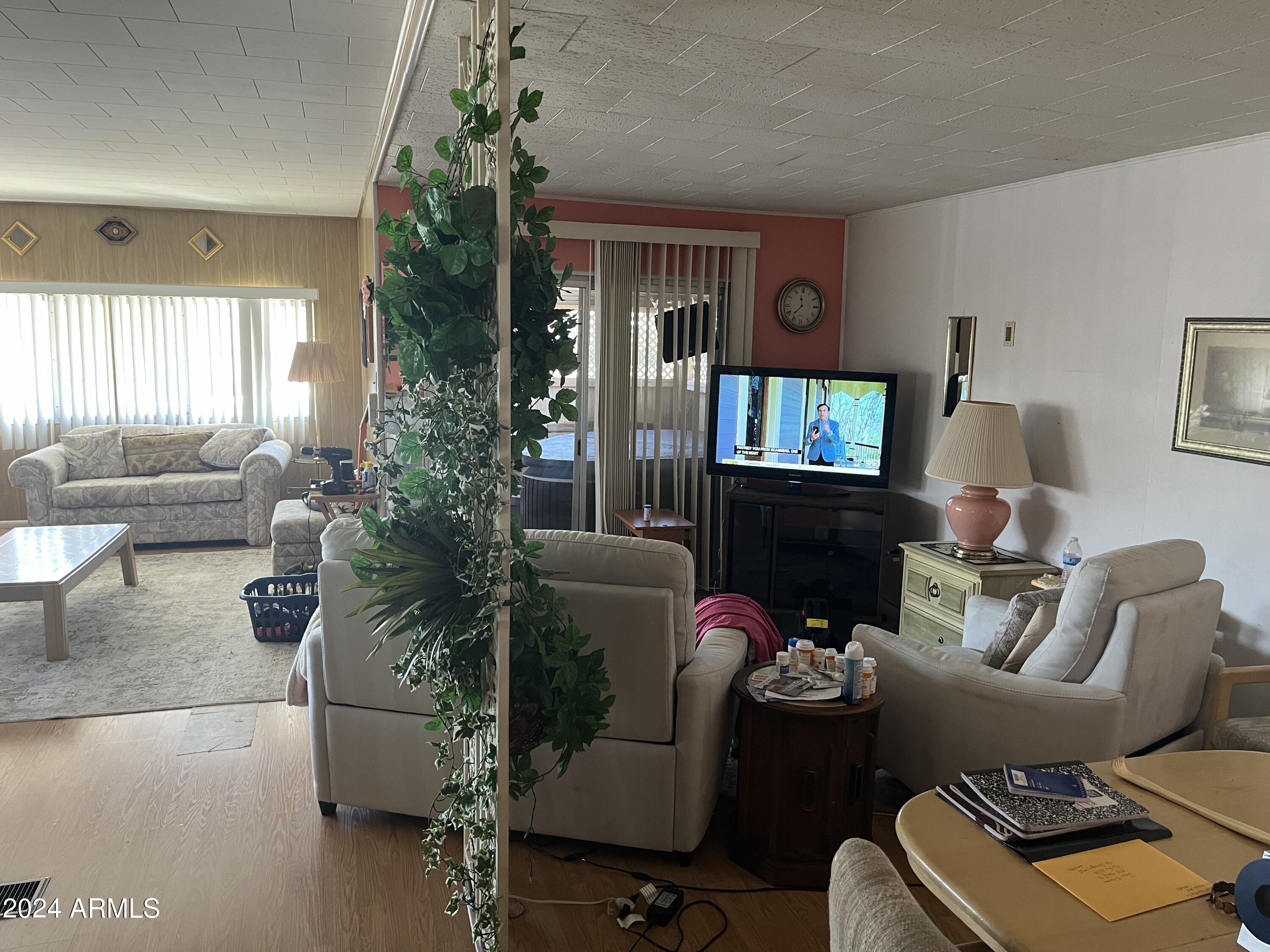 2460 East Main Street, Unit F2 Mesa, AZ 85213 - Photo 5 of 17 a living room with furniture and a window