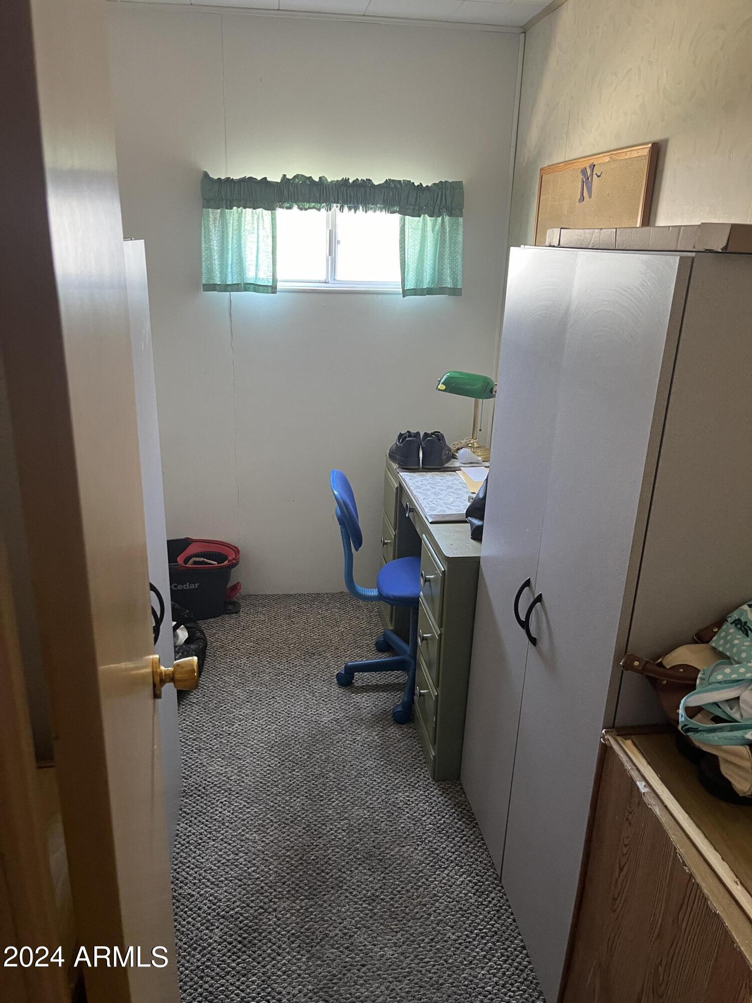 2460 East Main Street, Unit F2 Mesa, AZ 85213 - Photo 7 of 17 a room with gym equipment and a window