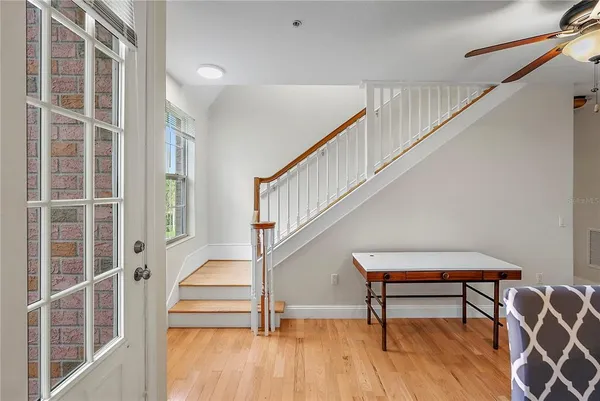 a view of entryway with wooden floor and stairs