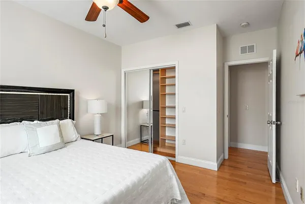 a bedroom with a bed and a walk in closet