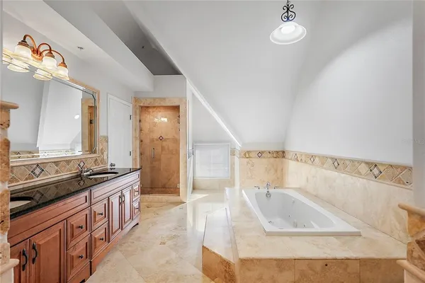 a bathroom with a double vanity sink a mirror and a shower