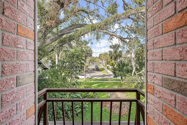a view of a garden from a balcony