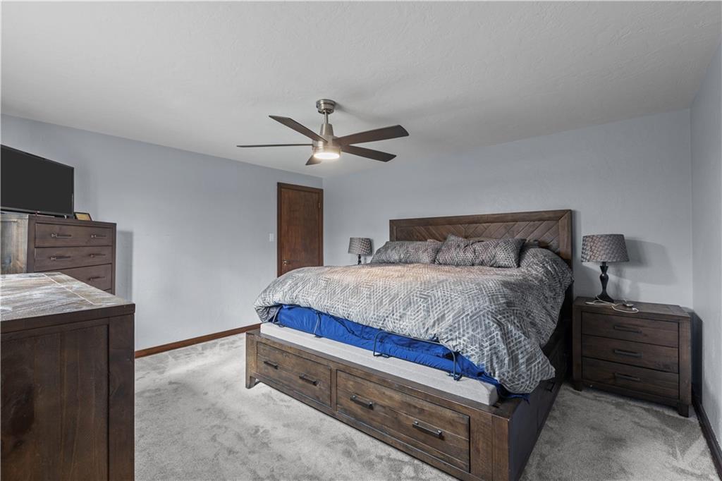 4 Harter Circle Pittsburgh, PA 15236 - Photo 13 of 29 a bedroom with a bed and a flat screen tv