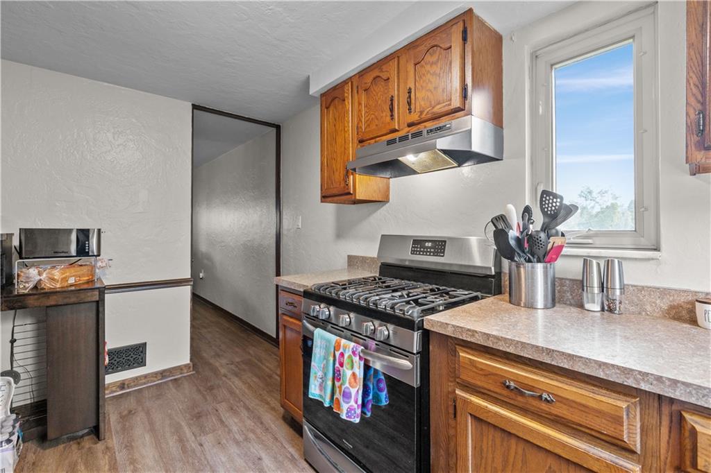 4 Harter Circle Pittsburgh, PA 15236 - Photo 18 of 29 a kitchen with stainless steel appliances granite countertop a stove and a refrigerator