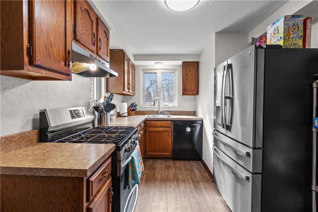 4 Harter Circle Pittsburgh, PA 15236 - Photo 19 of 29 a kitchen with a refrigerator stove and a sink