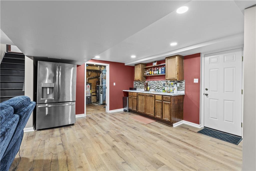 4 Harter Circle Pittsburgh, PA 15236 - Photo 25 of 29 a kitchen with stainless steel appliances kitchen island granite countertop a refrigerator and a stove