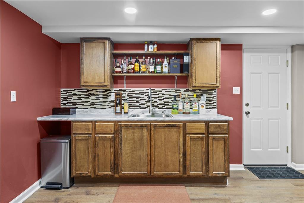 4 Harter Circle Pittsburgh, PA 15236 - Photo 26 of 29 a kitchen with stainless steel appliances granite countertop a sink and a wooden cabinets