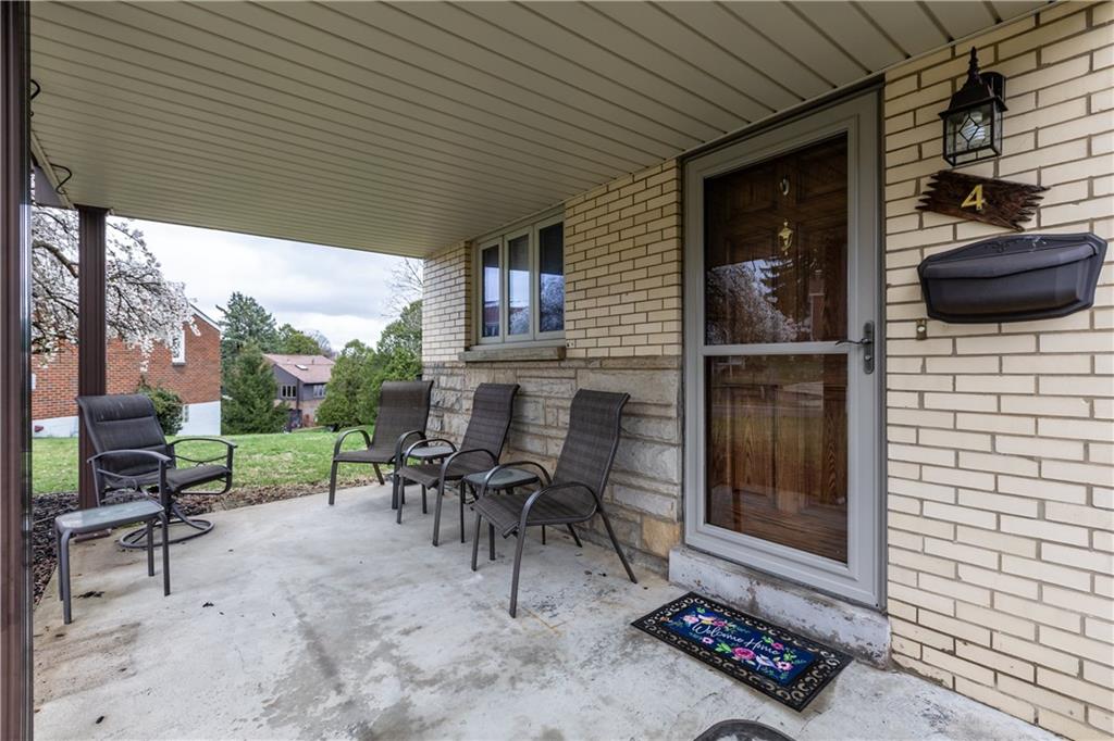 4 Harter Circle Pittsburgh, PA 15236 - Photo 29 of 29 a view of a patio with table and chairs next to a yard