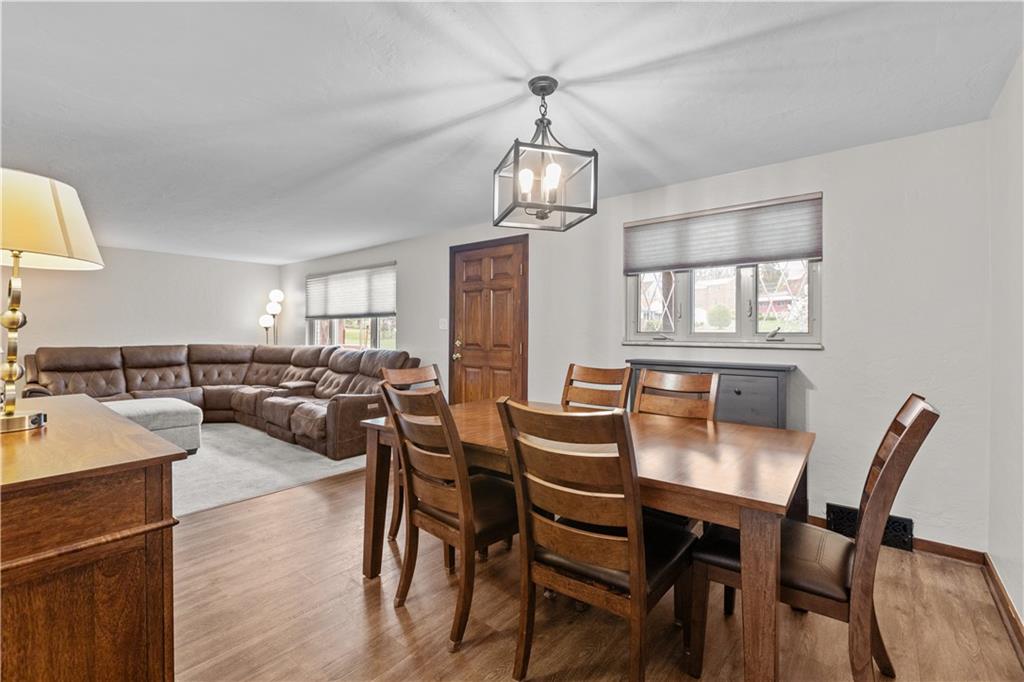 4 Harter Circle Pittsburgh, PA 15236 - Photo 7 of 29 a view of a dining room with furniture a chandelier and wooden floor