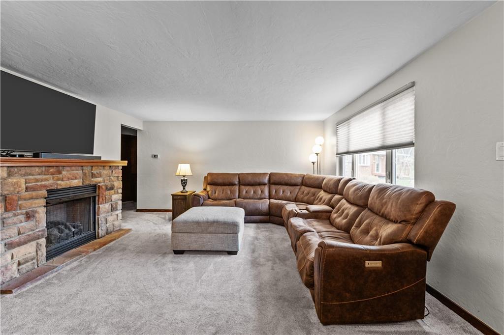 4 Harter Circle Pittsburgh, PA 15236 - Photo 9 of 29 a living room with furniture a fireplace and a flat screen tv
