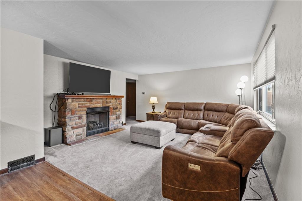 4 Harter Circle Pittsburgh, PA 15236 - Photo 10 of 29 a living room with furniture a fireplace and a flat screen tv