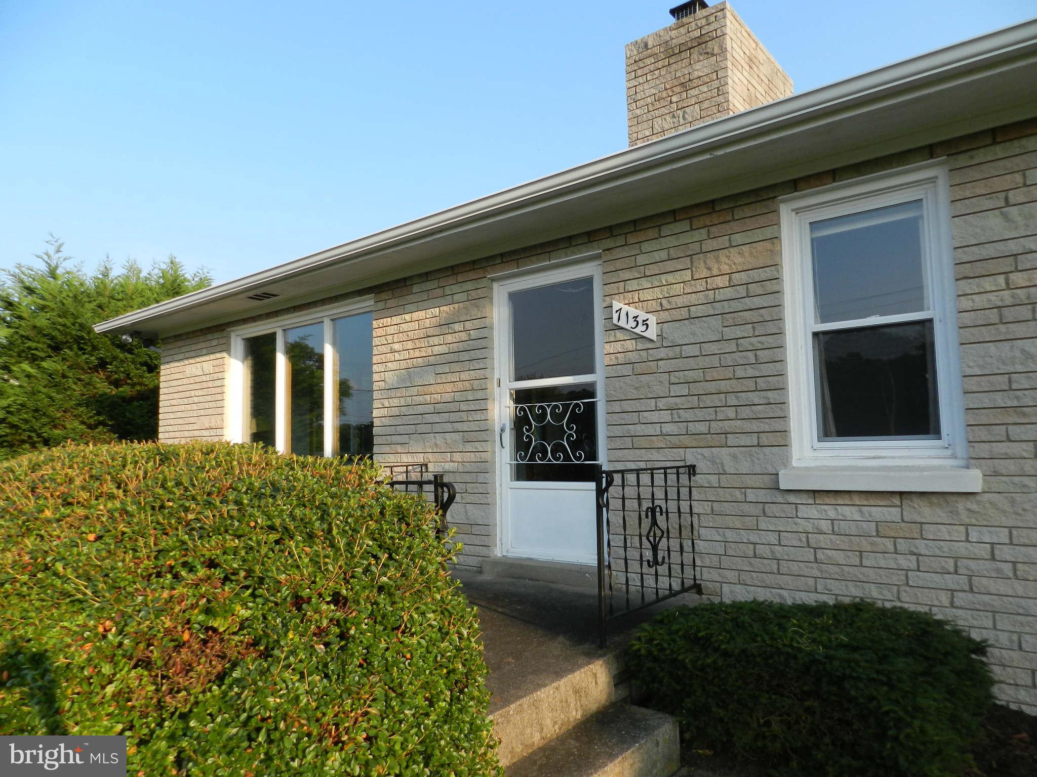 7135 Bowers Road Frederick, MD 21702 - Photo 1 of 30 a front view of a house with a yard