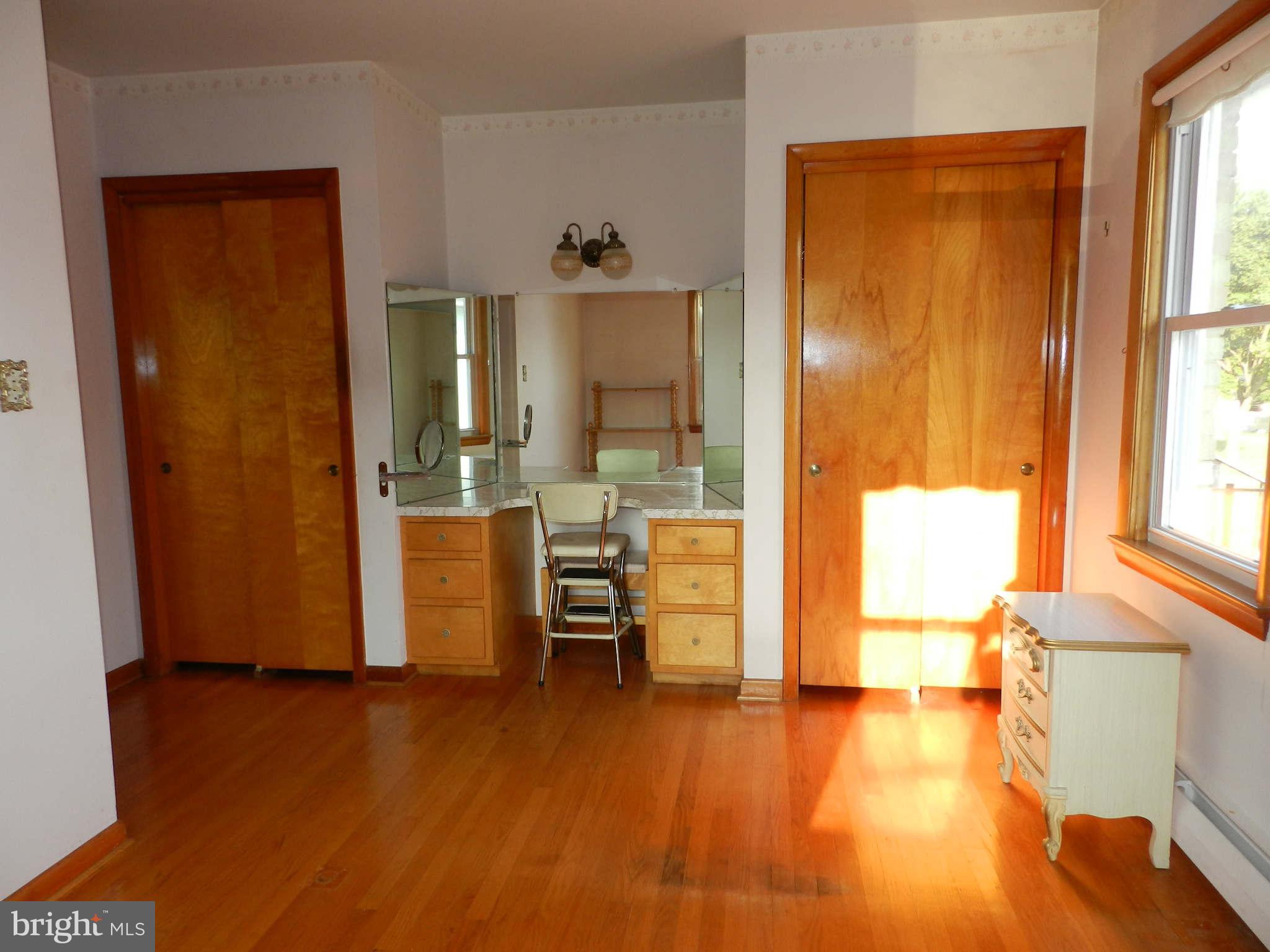 7135 Bowers Road Frederick, MD 21702 - Photo 19 of 30 a view of a living room with windows and wooden floor