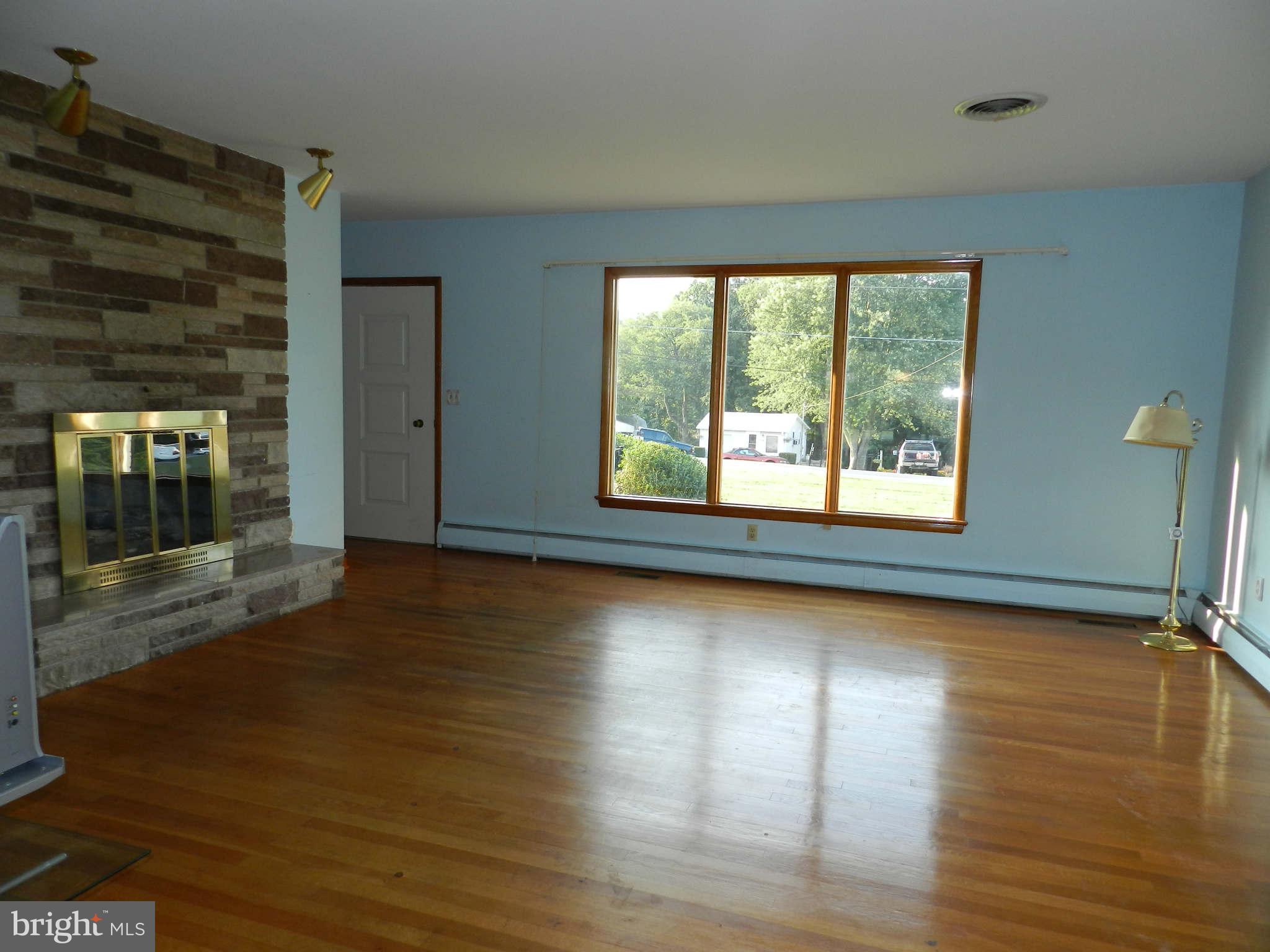 7135 Bowers Road Frederick, MD 21702 - Photo 3 of 30 a view of a room with wooden floor and window