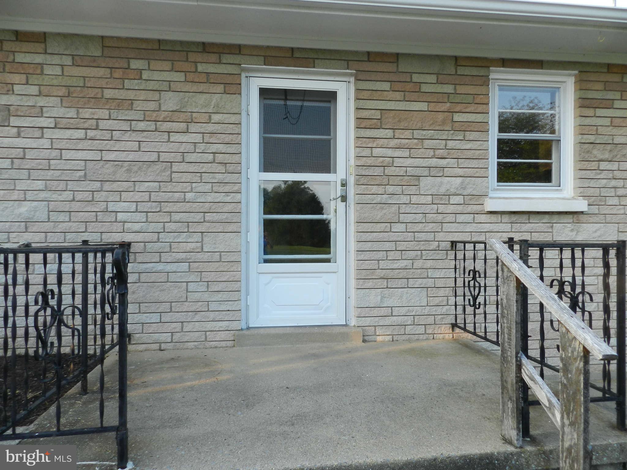7135 Bowers Road Frederick, MD 21702 - Photo 25 of 30 a view of front door of house with stairs