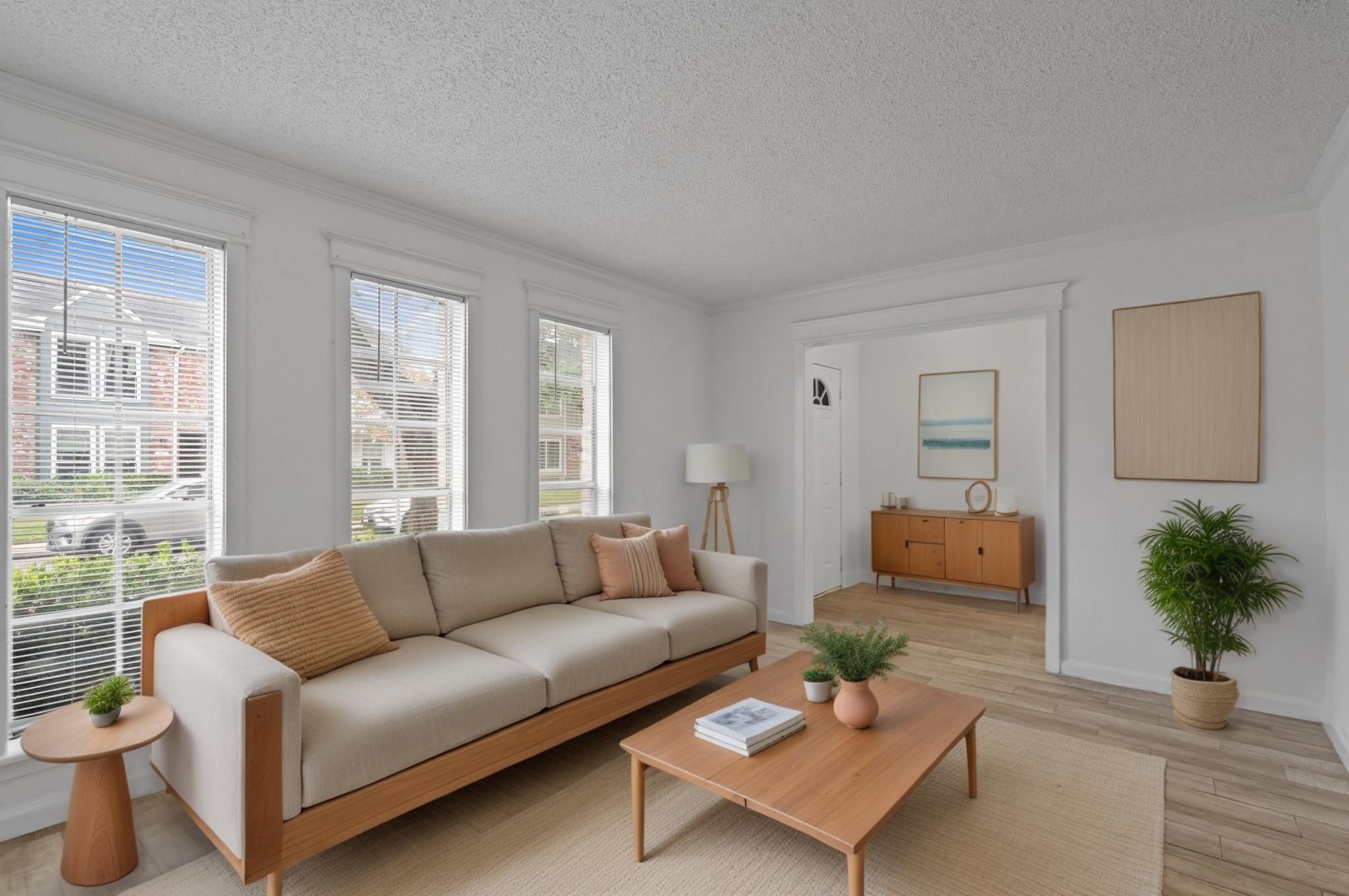 11002 Hammerly Boulevard, Unit 61 Houston, TX 77043 - Photo 2 of 12 a living room with furniture and a large window