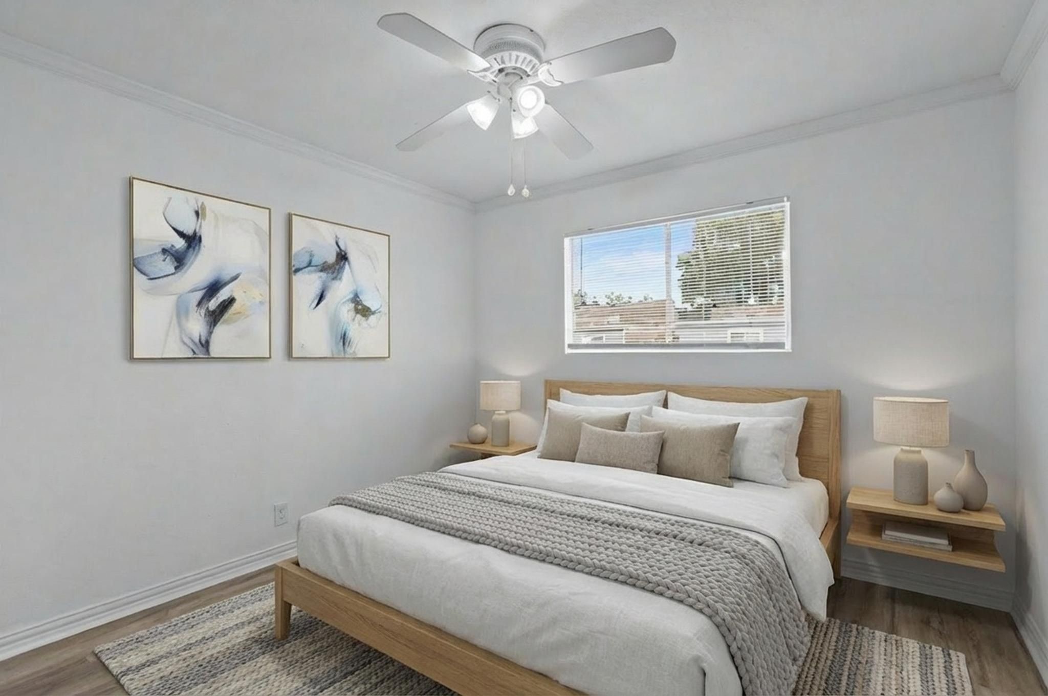 11002 Hammerly Boulevard, Unit 61 Houston, TX 77043 - Photo 8 of 12 a bedroom with a large bed and a chandelier