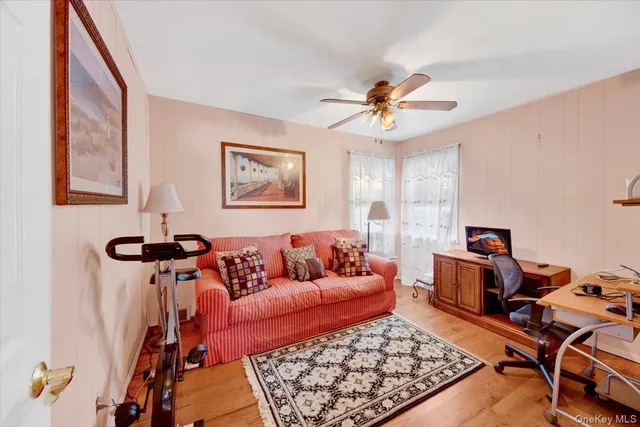 a living room with furniture and a rug