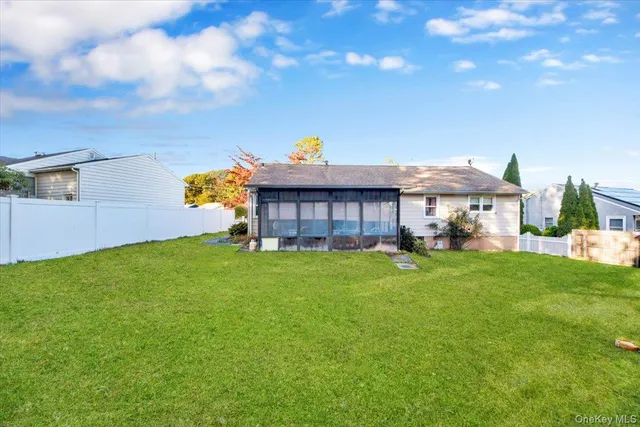 a view of a house with a backyard