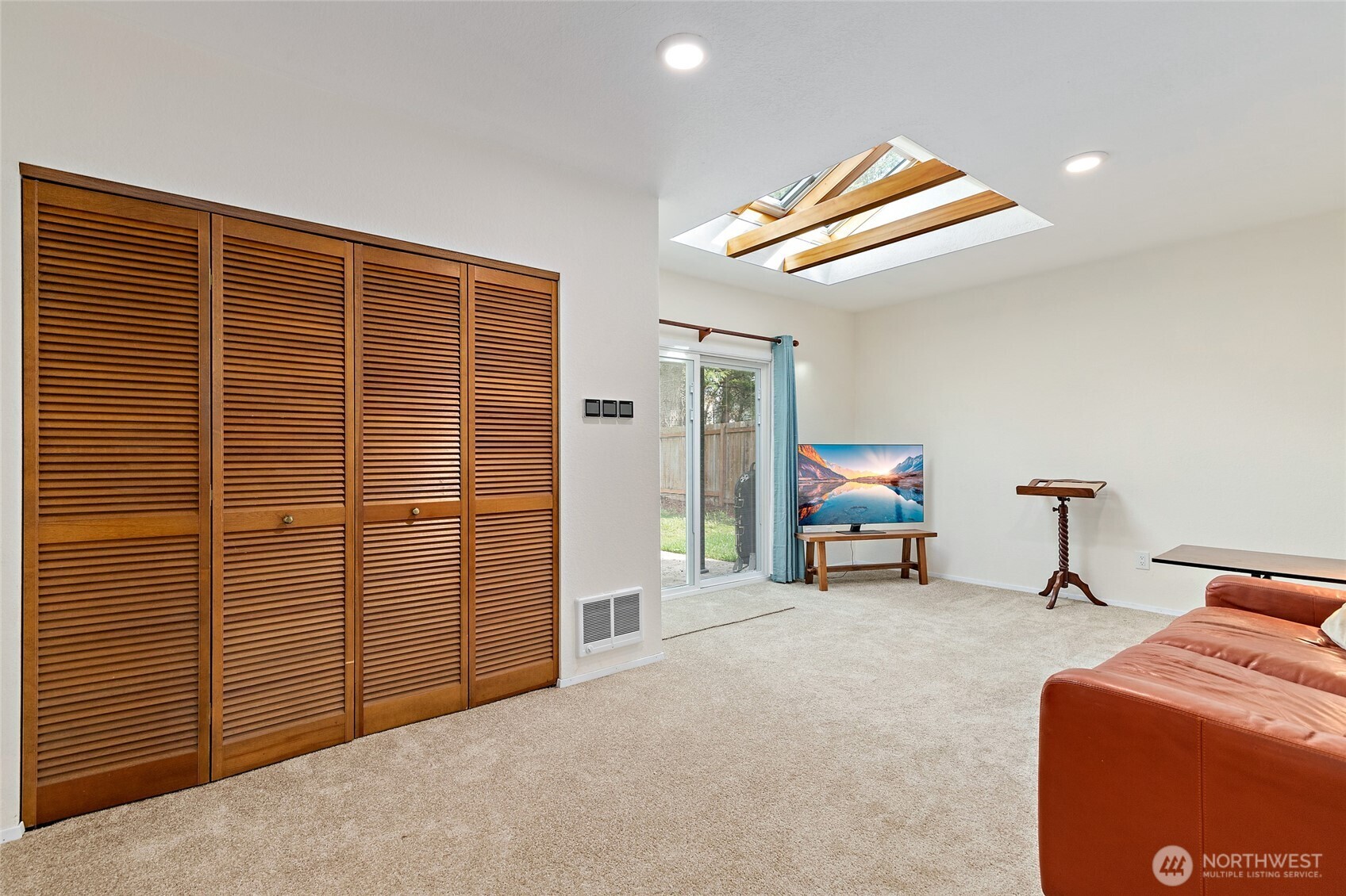4813 150th Place Southwest Edmonds, WA 98026 - Photo 13 of 28 a view of an empty room with furniture and a window