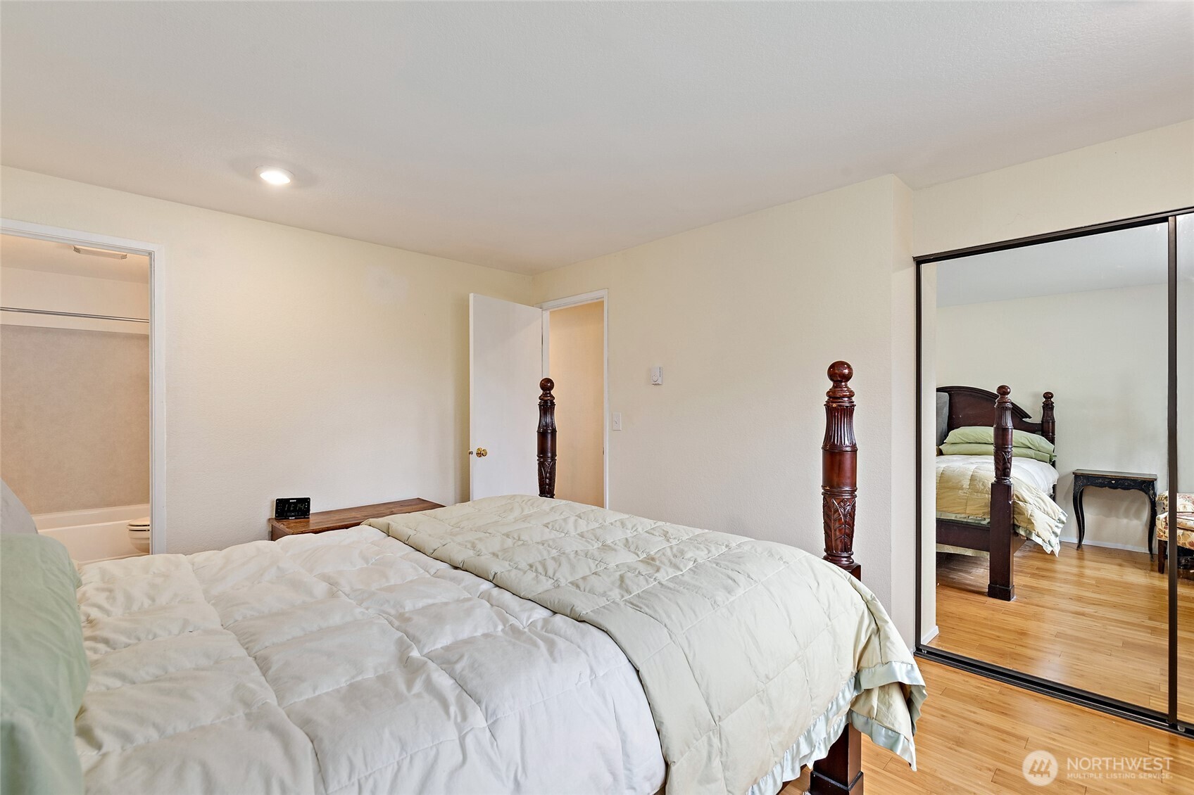 4813 150th Place Southwest Edmonds, WA 98026 - Photo 18 of 28 a bedroom with a bed and wooden floor