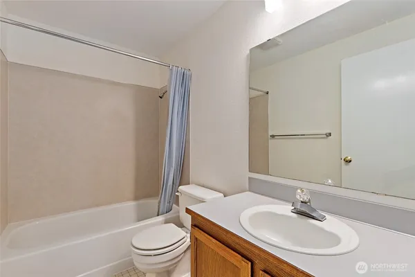 a bathroom with a sink a toilet and a bathtub